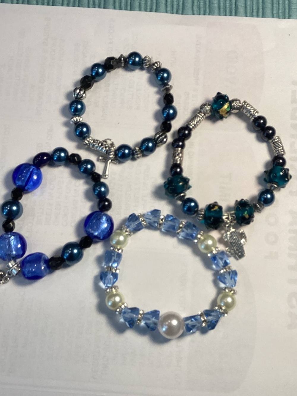 Bundle of 4 bracelets with charm.